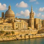 Panoramic view of Valletta, Malta, with limestone buildings and the sea