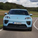 Porsche Macan Electric 2025 front view on mountain road